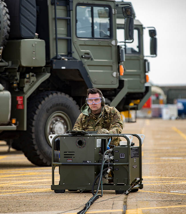 RAF Supplier operating portable generator in transport compound