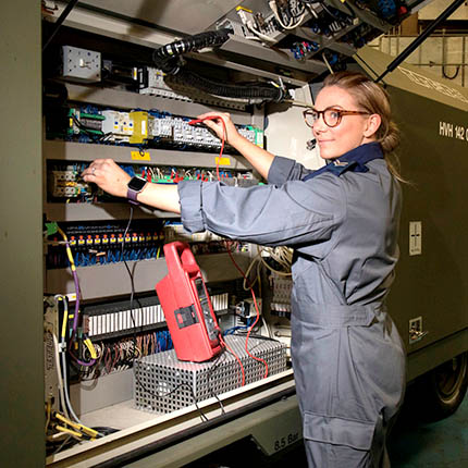 RAF Electrician running tests on mobile generator