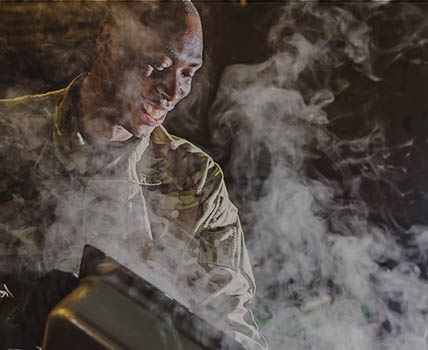 RAF Chef preparing to serve steaming hot food