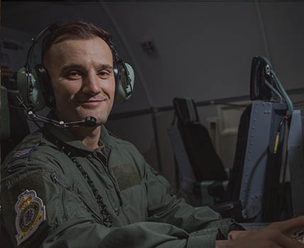 RAF Air Traffic and Weapons Controller wearing headset operating control equipment