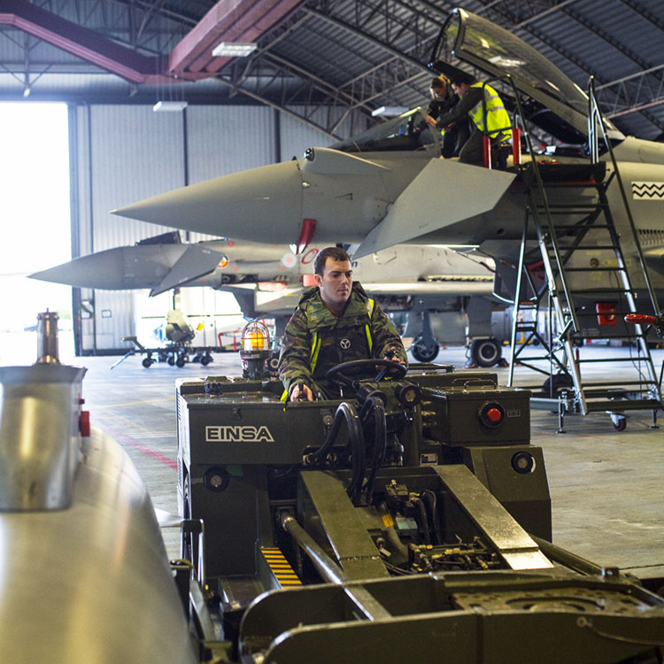 RAF Weapon Technician operating loader in Typhoon hangar