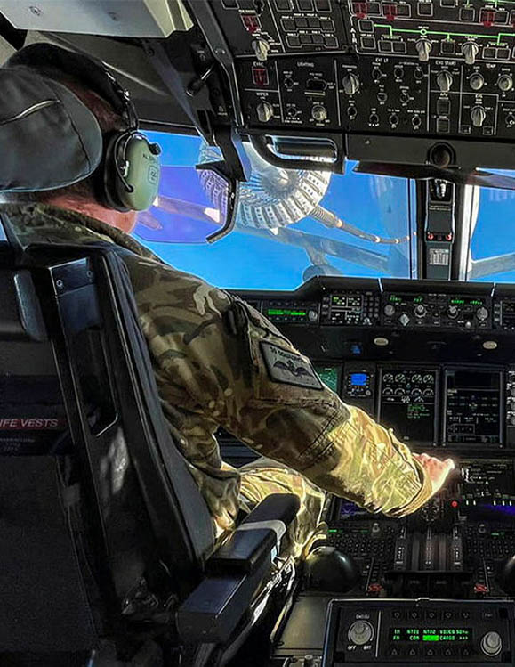 RAF Pilot flying A400 Atlas, receiving fuel from RAF Voyager mid-air