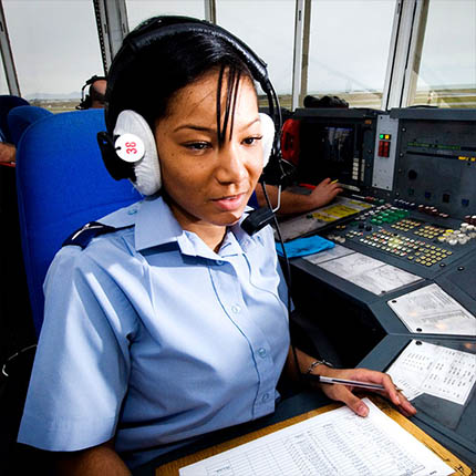 RAF Flight Operations Specialist in control tower with headset