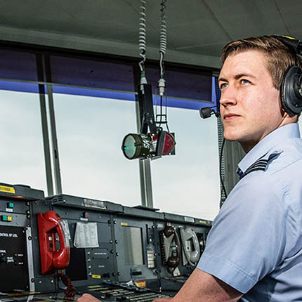 RAF Air Operations Systems Officer in control tower with headset