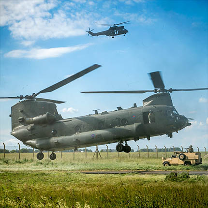 RAF Chinook and Puma helicopters hovering during exercise