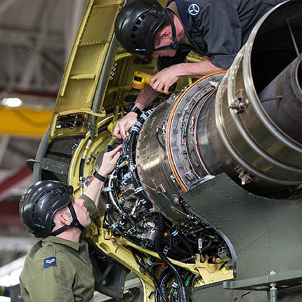 RAF Aircraft Technicians (Mechanical) working on Chinook helicopter engine