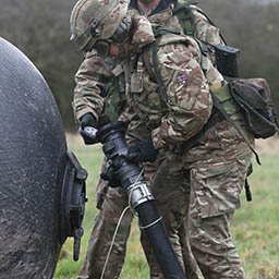 RAF Suppliers connecting aircraft refuelling hose to transportable rubber fuel cells