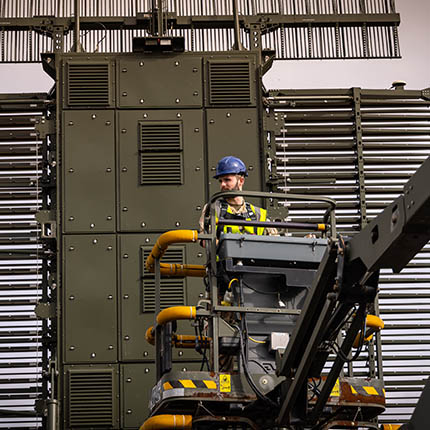 RAF Cyberspace Communications Specialist in platform lift to work on radar array