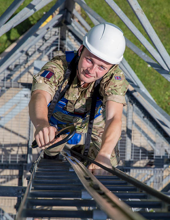 RAF Communications Infrastructure Technician climbing mast with safety harness