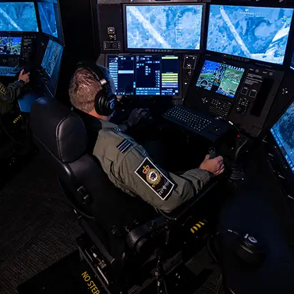 RAF Weapon Systems Officer (WSO) remotely controlling sensors on board a RAF Protector RG Mk1 remotely piloted aircraft
