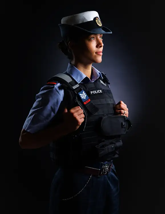 RAF Police Sergeant in blue uniform and protection vest