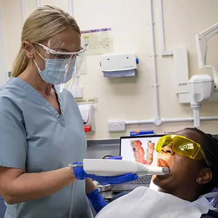 RAF Dental Nurse treating RAF patient in RAF Dental Surgery