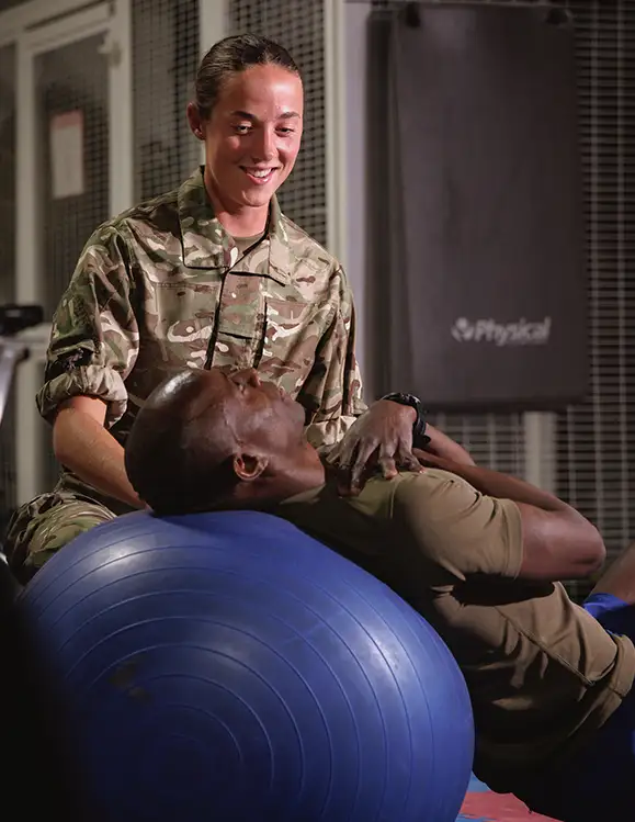 RAF Medical Support Officer (Physiotherapist) treating patient in gym