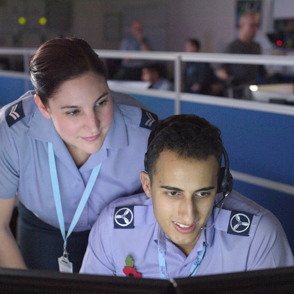 Female and male Cyberspace Communication specialists inspecting network traffic